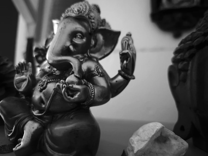 Bronze statue of ganesha with intricate details.